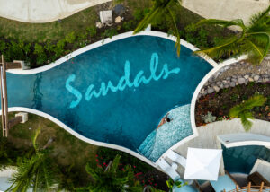 Aerial view of Sandals Ocho Rios resort pool in Jamaica with tropical layout photographed by Ebis Hernandez