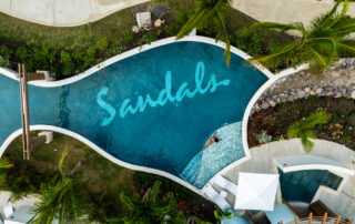Aerial view of Sandals Ocho Rios resort pool in Jamaica with tropical layout photographed by Ebis Hernandez