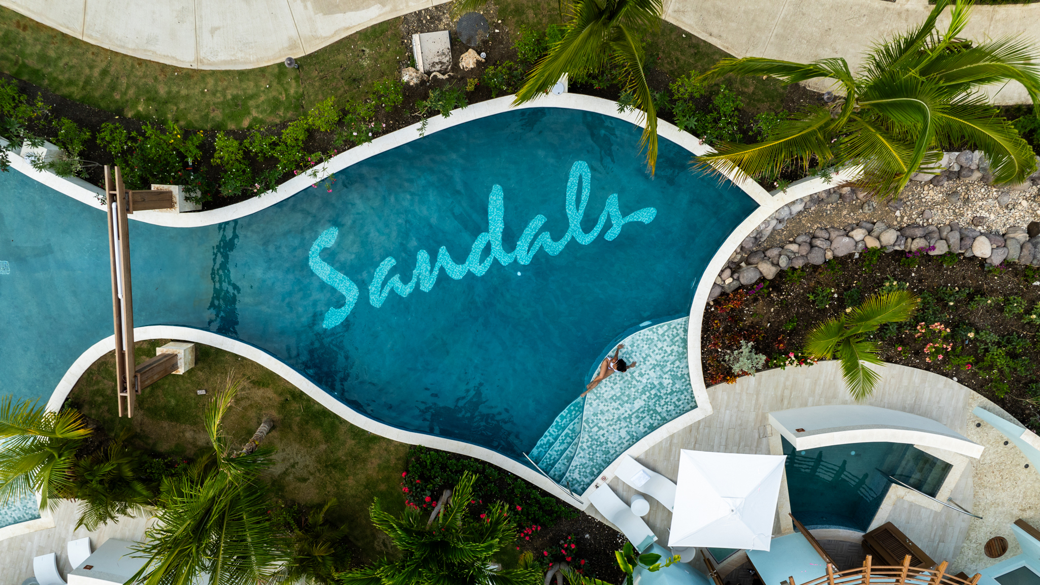 Aerial view of Sandals Ocho Rios resort pool in Jamaica with tropical layout photographed by Ebis Hernandez