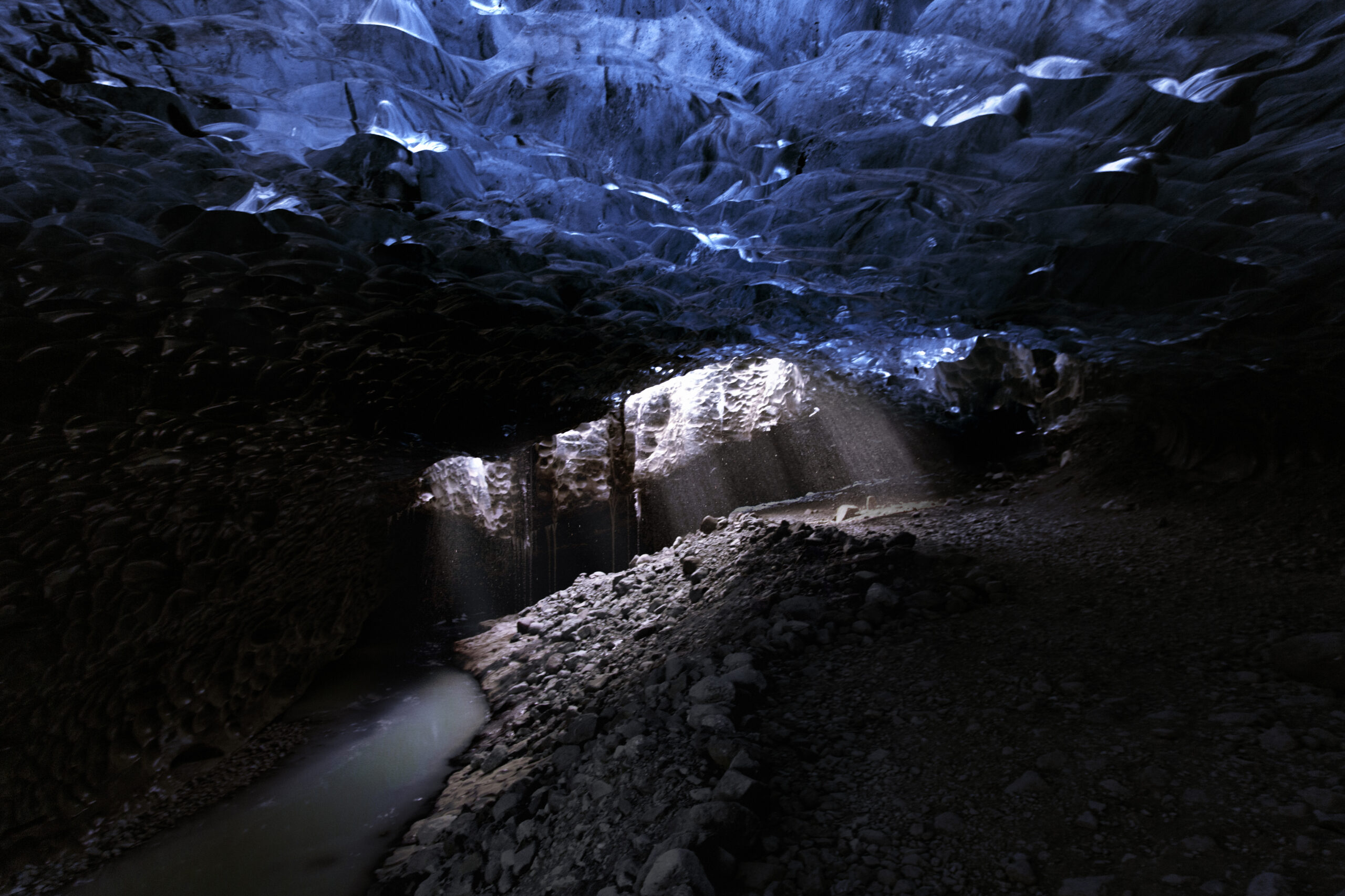 frozen-beauty-ice-cave-light.jpg Light breaking through an ice cave revealing layered textures and depth, from the Frozen Beauty series by Ebis Hernandez