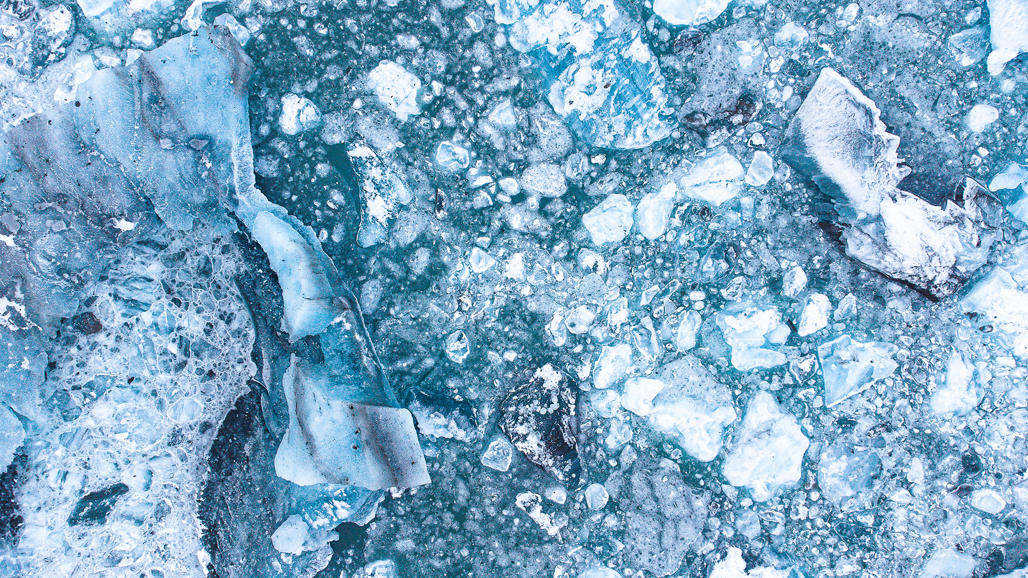 Abstract composition of cracked and fragmented ice patterns, part of the Frozen Beauty series by Ebis Hernandez