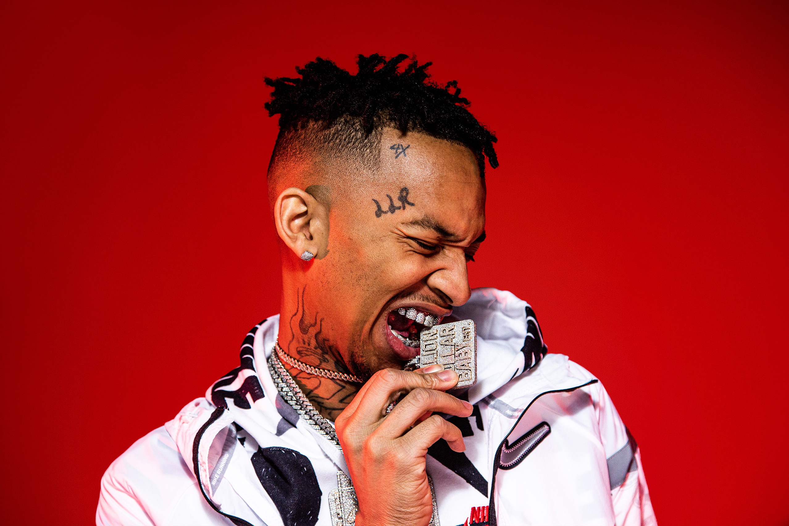 Stunna 4 Vegas studio portrait on red background by photographer Ebis Hernandez
